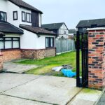 Driveway preparation and excavation works in a side alley before laying block paving.