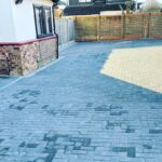 Large herringbone block paved driveway area showing extensive ground coverage and brickwork.